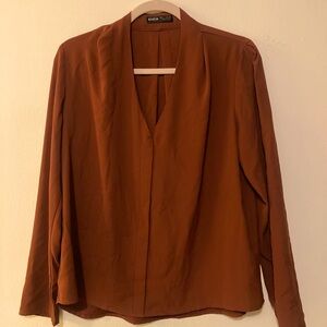 Long-sleeved v-neck blouse in burnt orange